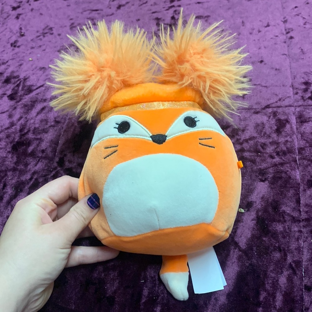 Small orange fuzzy haired fox squish mellow